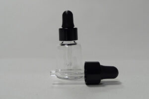 Botella de tubo de vidrio transparente con cuentagotas tapa urea negra y tetina negra