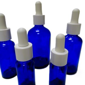 Frasco-vidrio-azul-cobalto-cuentagotas-urea-blanca-tetina-blanca-Fusté