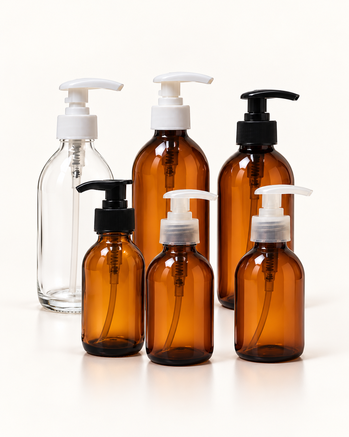 Envases de vidrio y PET topacio con bombas dosificadoras blancas, negras y transparentes